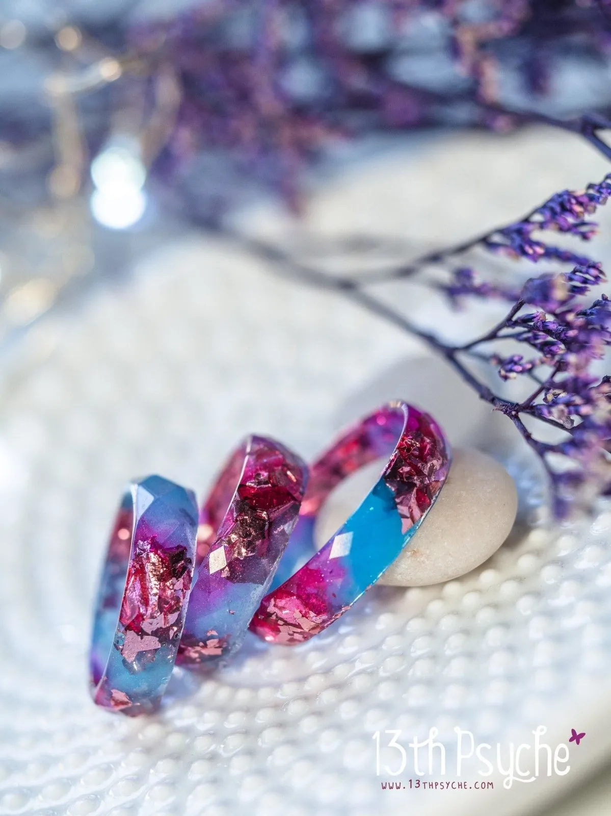 Blue and fuschia faceted resin ring with pink metallic flakes