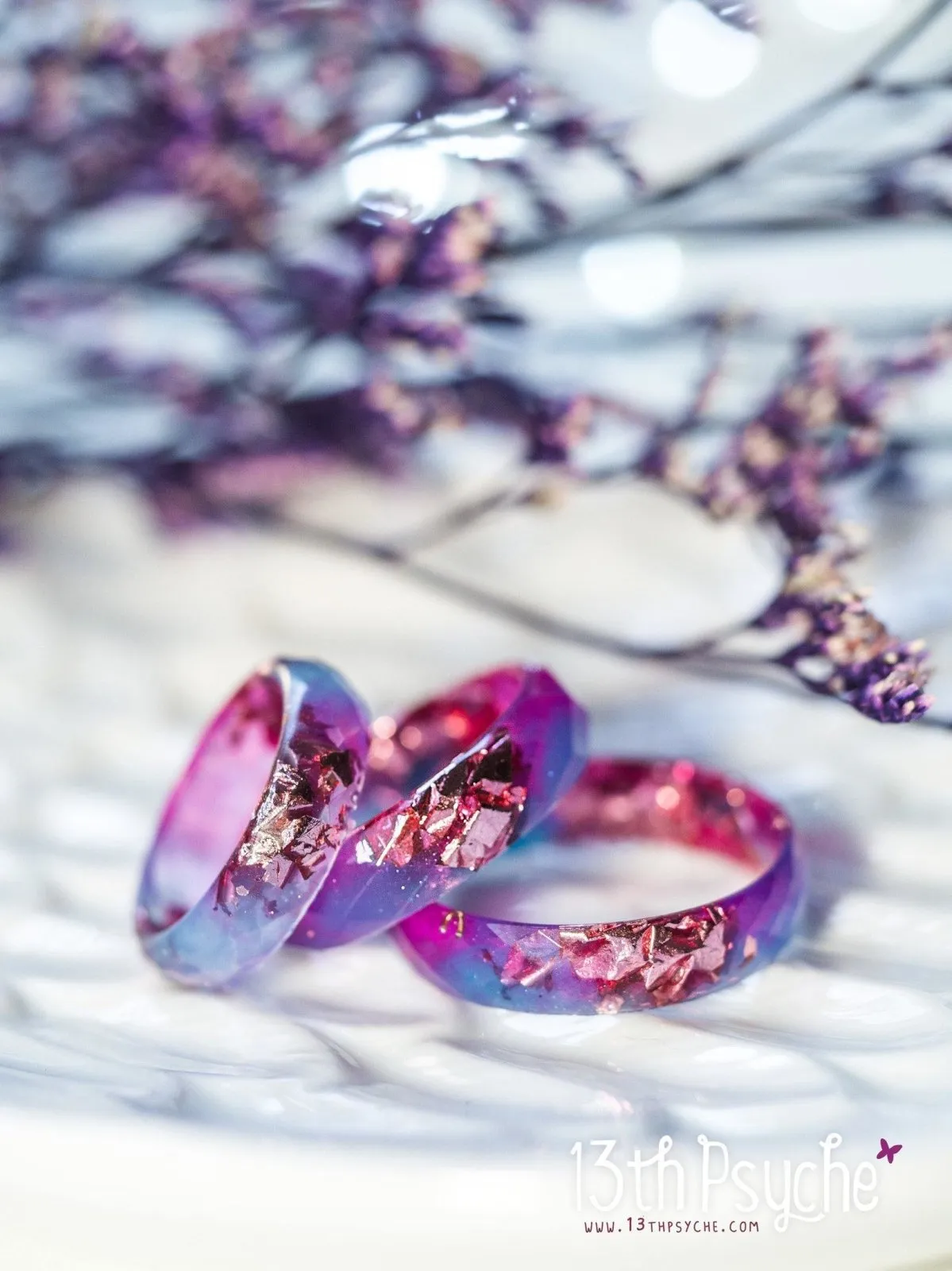 Blue and fuschia faceted resin ring with pink metallic flakes