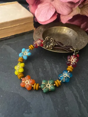 Flower czech glass and bronze metal, leather bracelet.