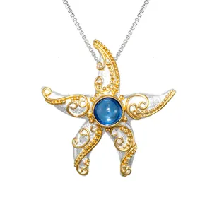 Michou Sterling Silver   Gold Vermeil Starfish Pendant with Blue Topaz