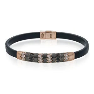 This men's bracelet features a pattern made from 14k yellow gold and titanium set with .57 ctw of black diamonds.