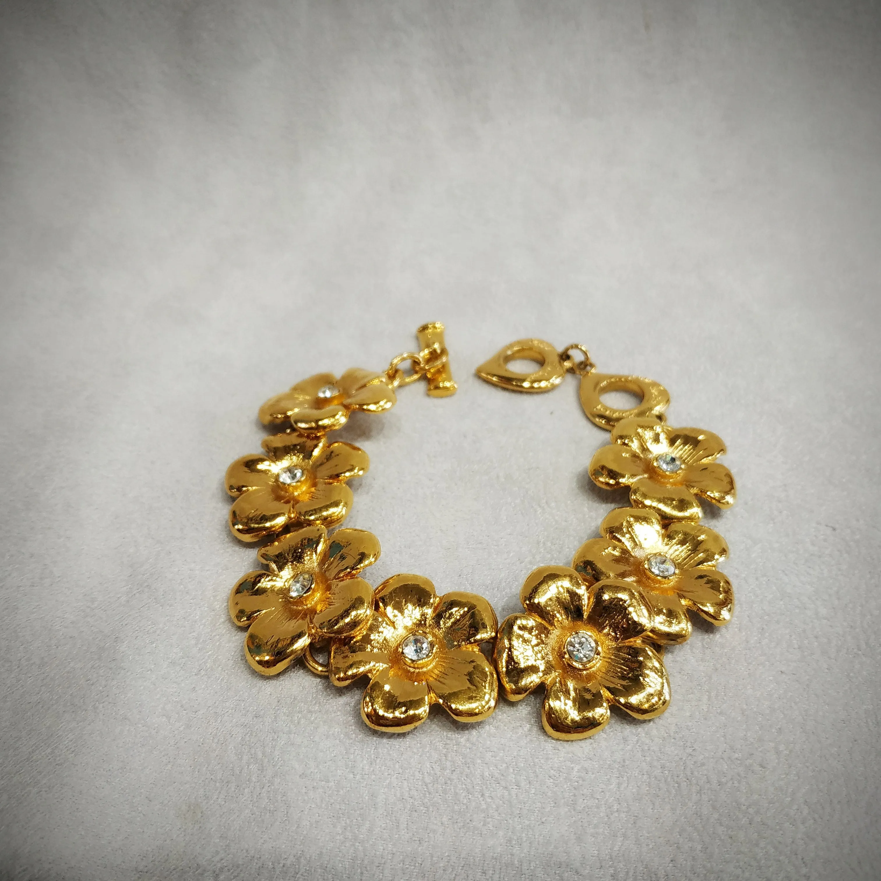 Yves Saint Laurent golden flower bracelet