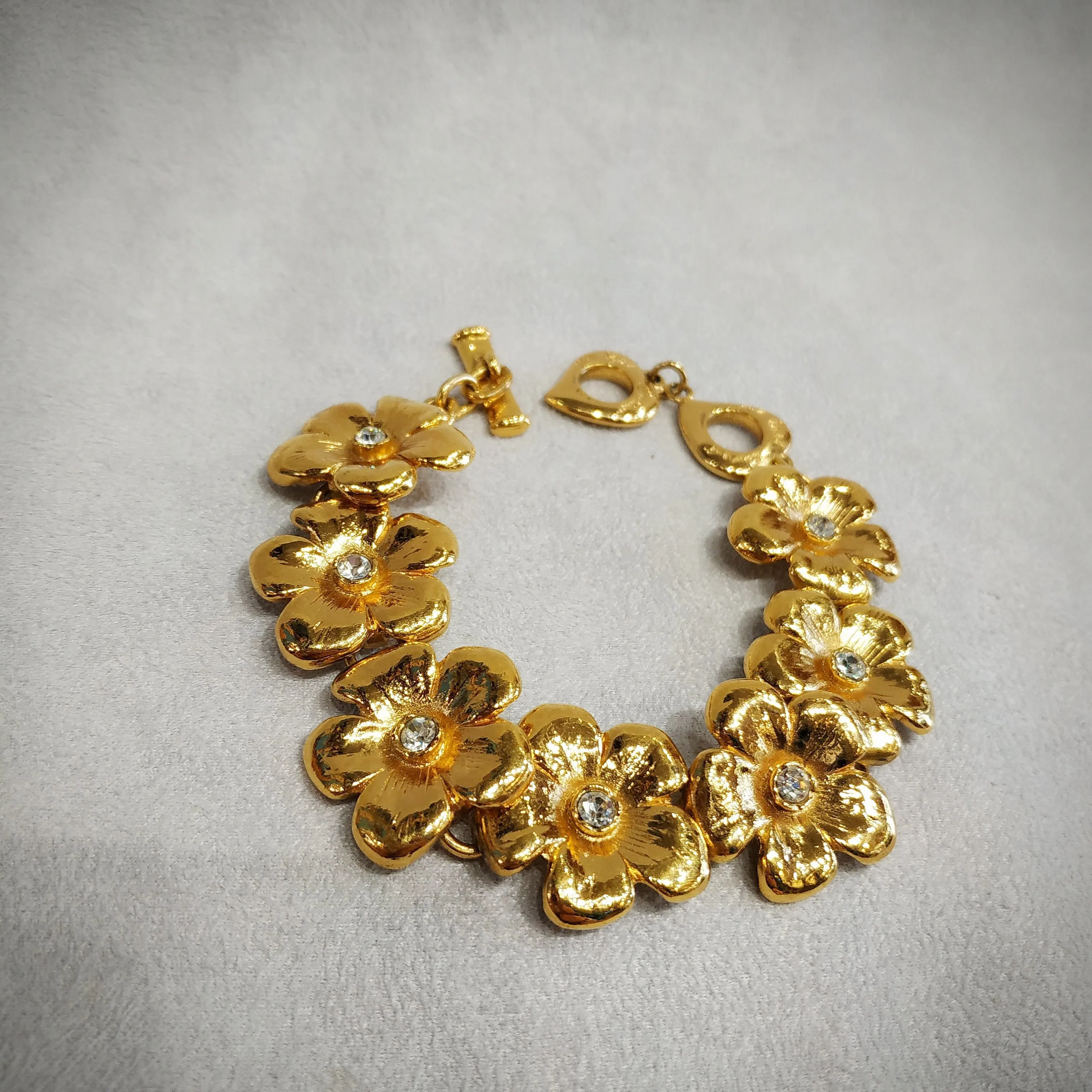 Yves Saint Laurent golden flower bracelet